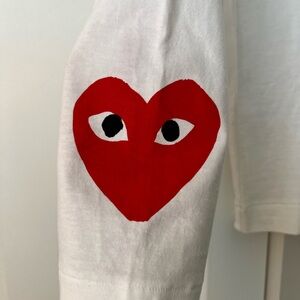 Small white long sleeve t-shirt with red hearts